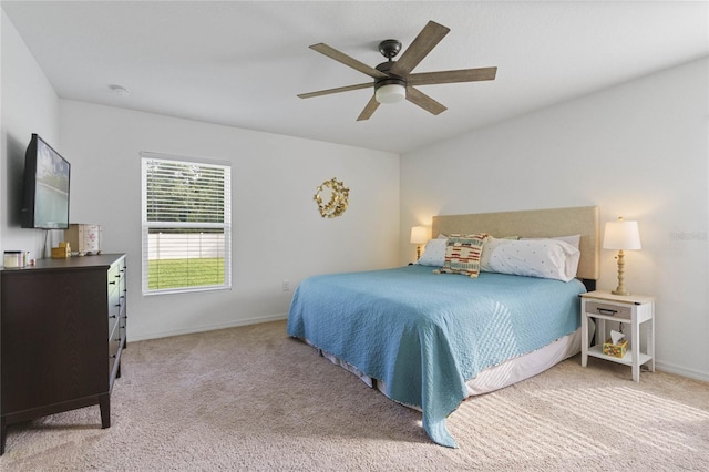 bedroom with ceiling fan and light colored carpet