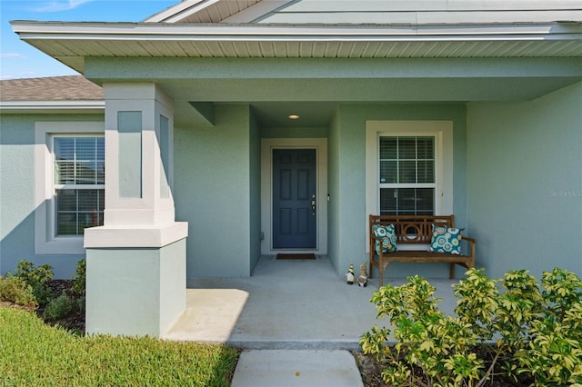 entrance to property featuring a porch