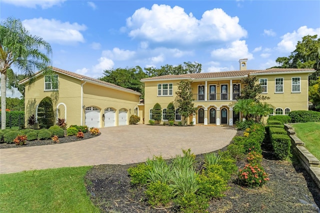 mediterranean / spanish-style house featuring a garage