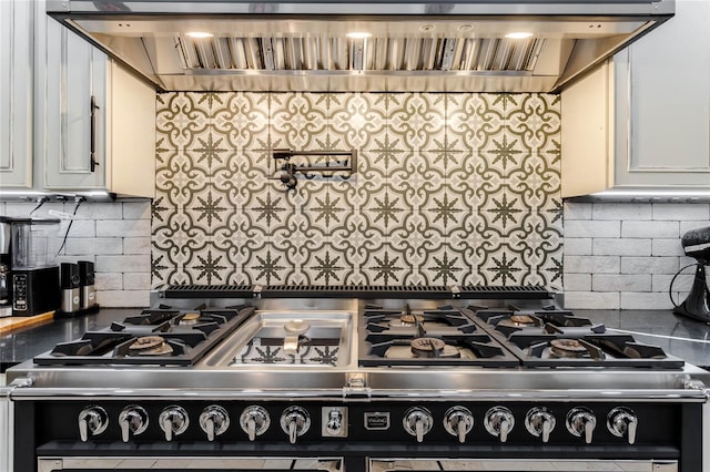 kitchen with white cabinets, backsplash, and exhaust hood