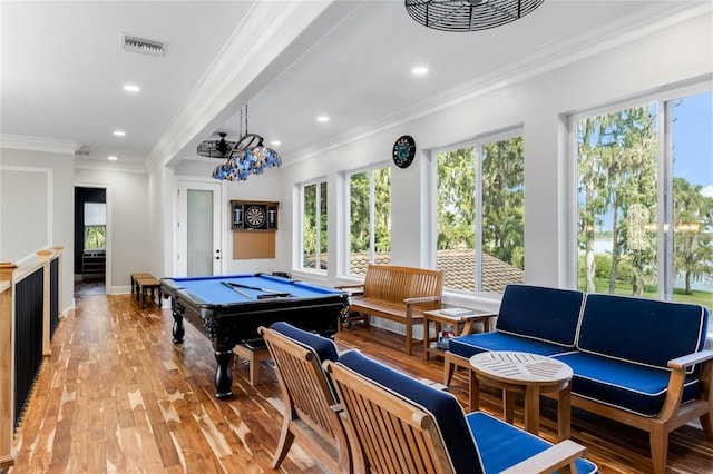 playroom featuring light wood-type flooring, pool table, and ornamental molding