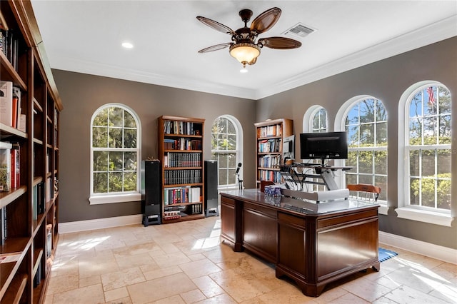 unfurnished office featuring ornamental molding, ceiling fan, and a healthy amount of sunlight