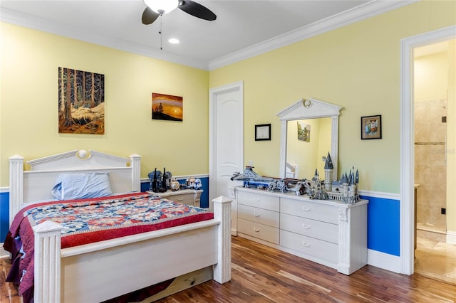 bedroom with ceiling fan, ensuite bathroom, crown molding, and dark wood-type flooring