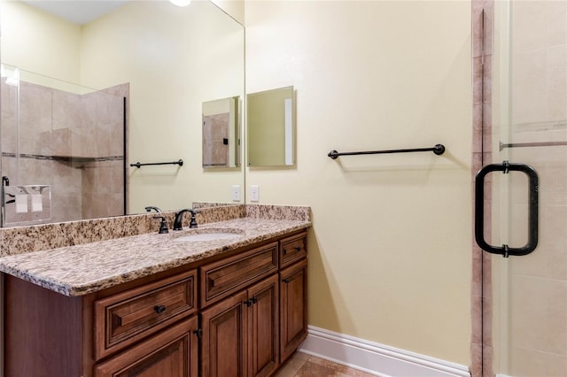 bathroom with vanity, tile patterned flooring, and a shower with shower door