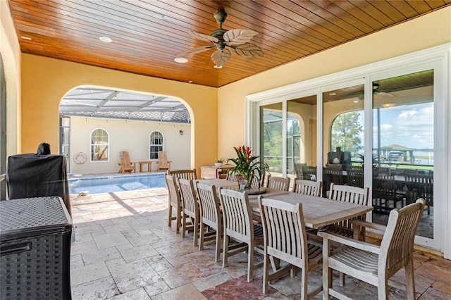 view of patio / terrace featuring a lanai and ceiling fan