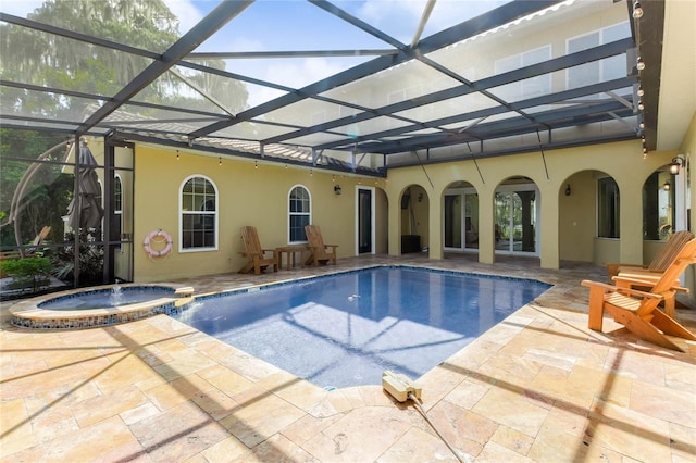 view of swimming pool with an in ground hot tub, a lanai, and a patio area