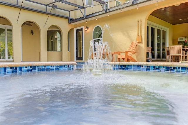 view of pool featuring pool water feature