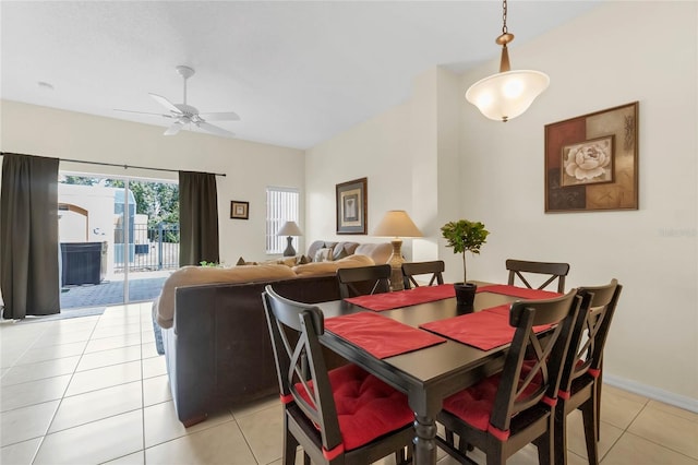 dining space with ceiling fan and light tile patterned floors