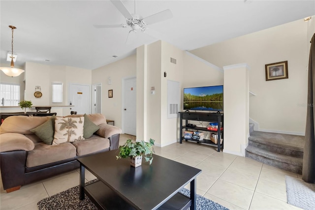 living room featuring ceiling fan and light tile patterned floors