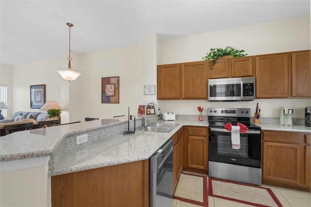 kitchen with pendant lighting, light tile patterned flooring, sink, kitchen peninsula, and stainless steel appliances