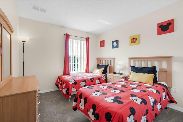 carpeted bedroom with a textured ceiling