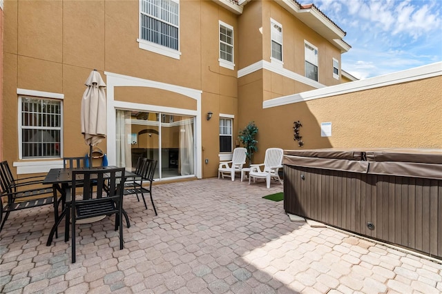 view of patio with a hot tub