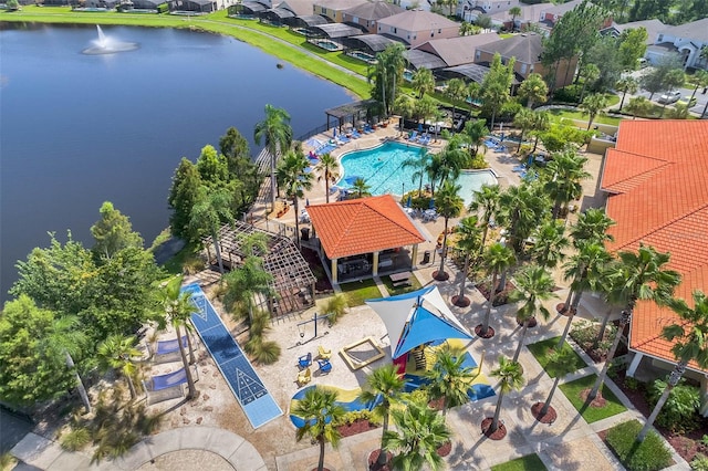 birds eye view of property with a water view