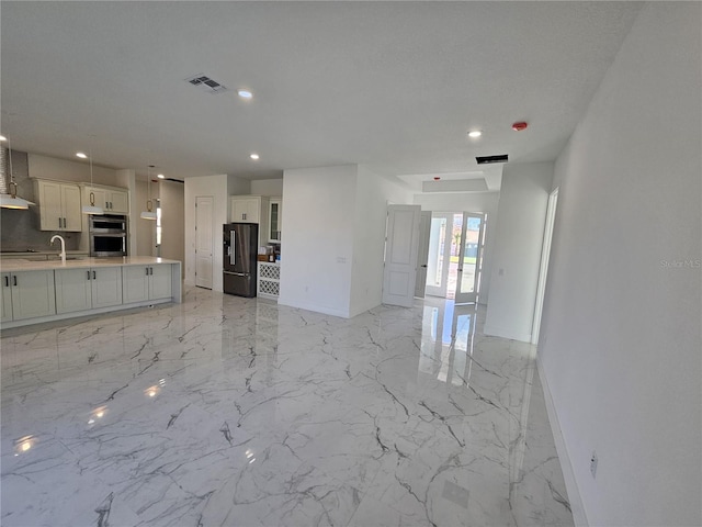 unfurnished living room featuring french doors