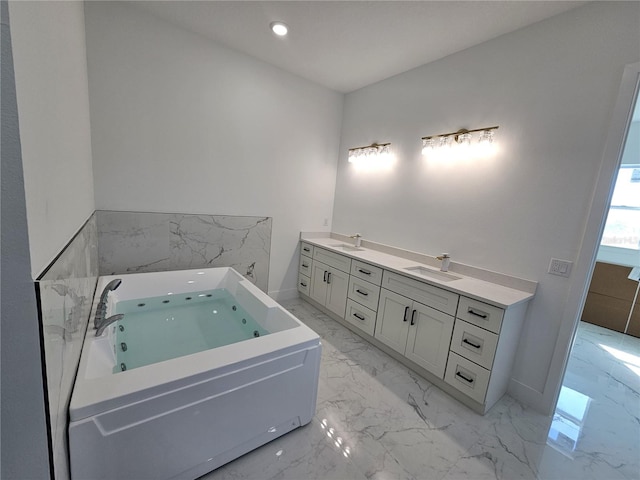 bathroom featuring a bathing tub and vanity