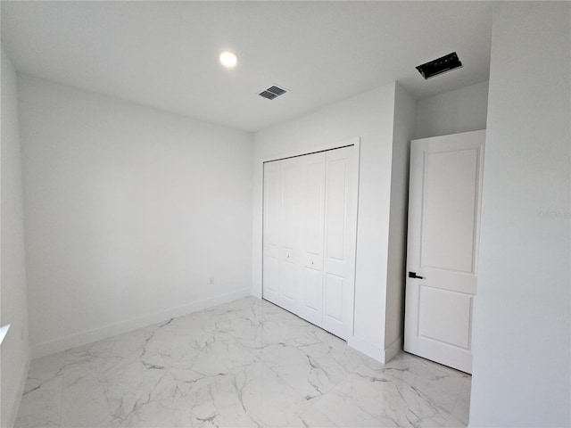 unfurnished bedroom with a closet