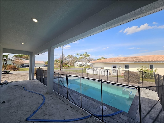 view of swimming pool with a patio