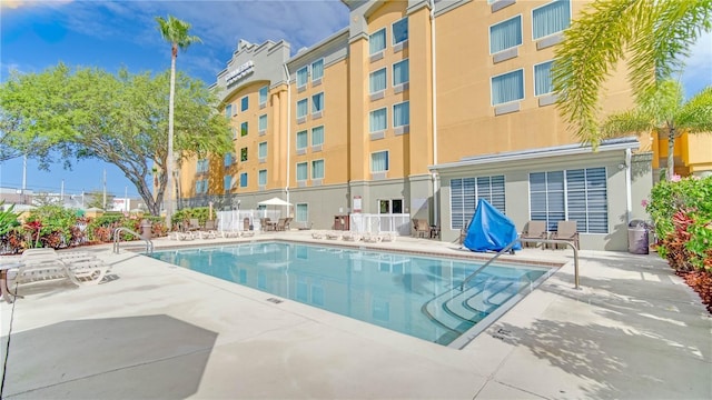 view of swimming pool featuring a patio area