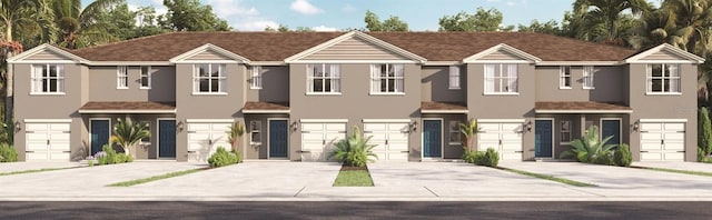 townhome / multi-family property with a garage