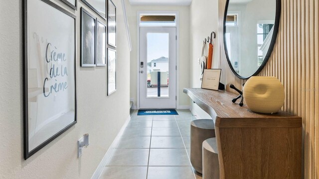 doorway featuring light tile patterned floors