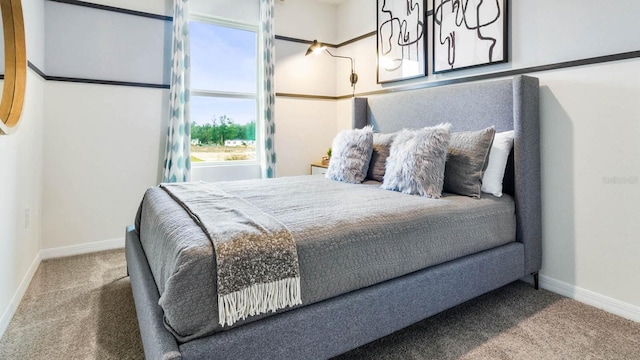 carpeted bedroom featuring multiple windows