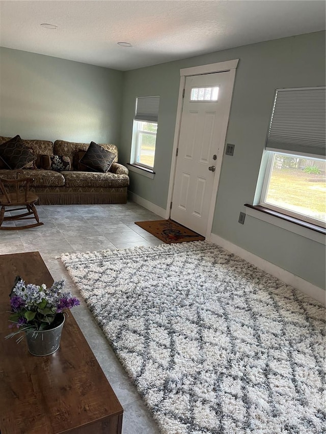 foyer with a textured ceiling