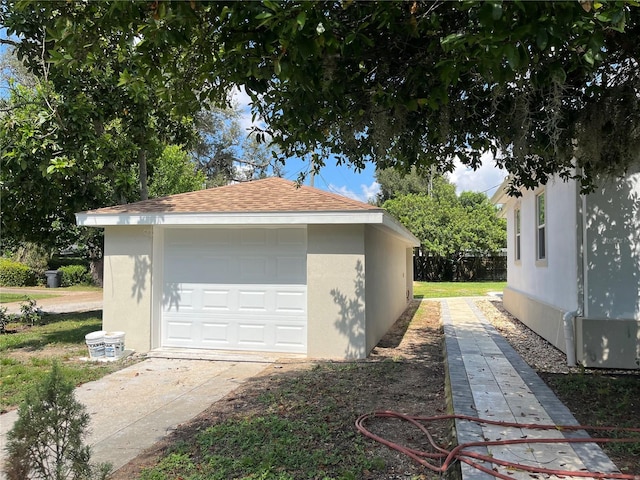 view of property exterior featuring an outbuilding and a garage