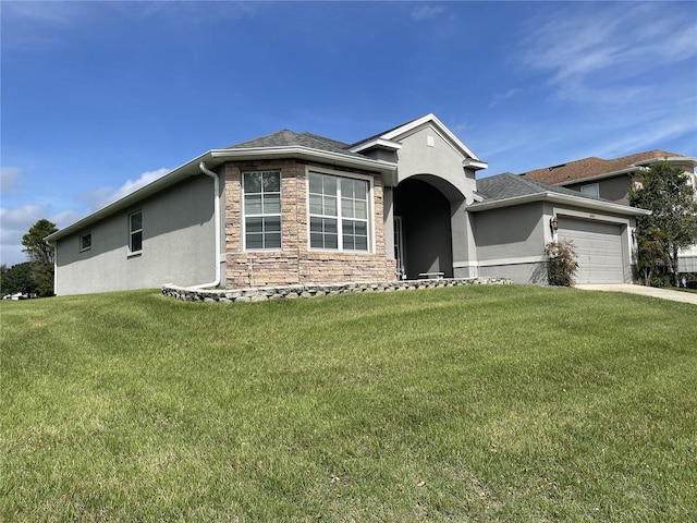 ranch-style home with driveway, an attached garage, stucco siding, a front lawn, and stone siding