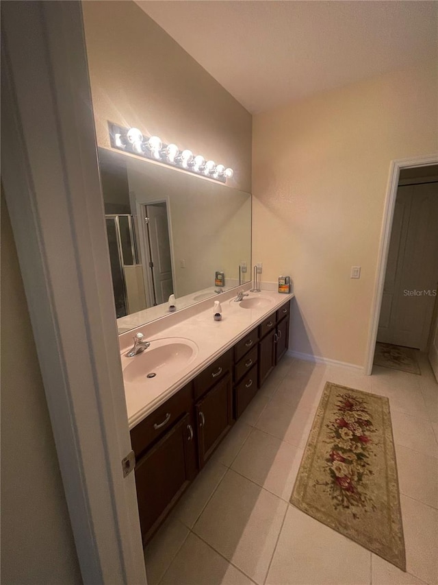 bathroom with tile patterned flooring and vanity