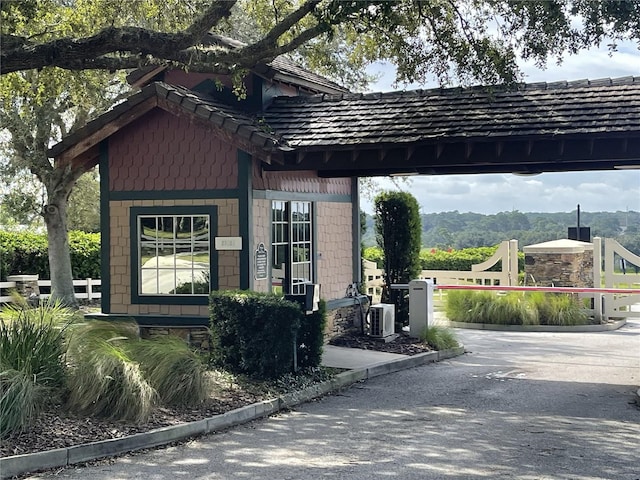 view of home's exterior featuring volleyball court