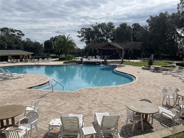 view of swimming pool with a gazebo and a patio area