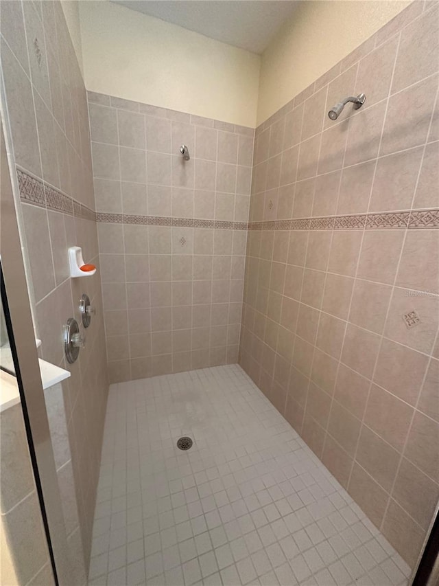 bathroom with tiled shower