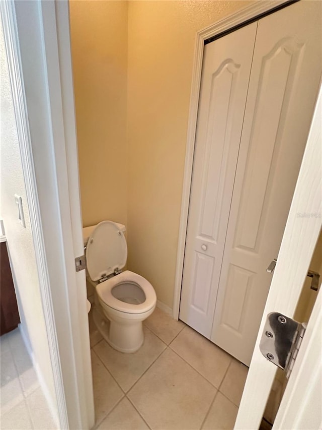 bathroom with tile patterned floors and toilet