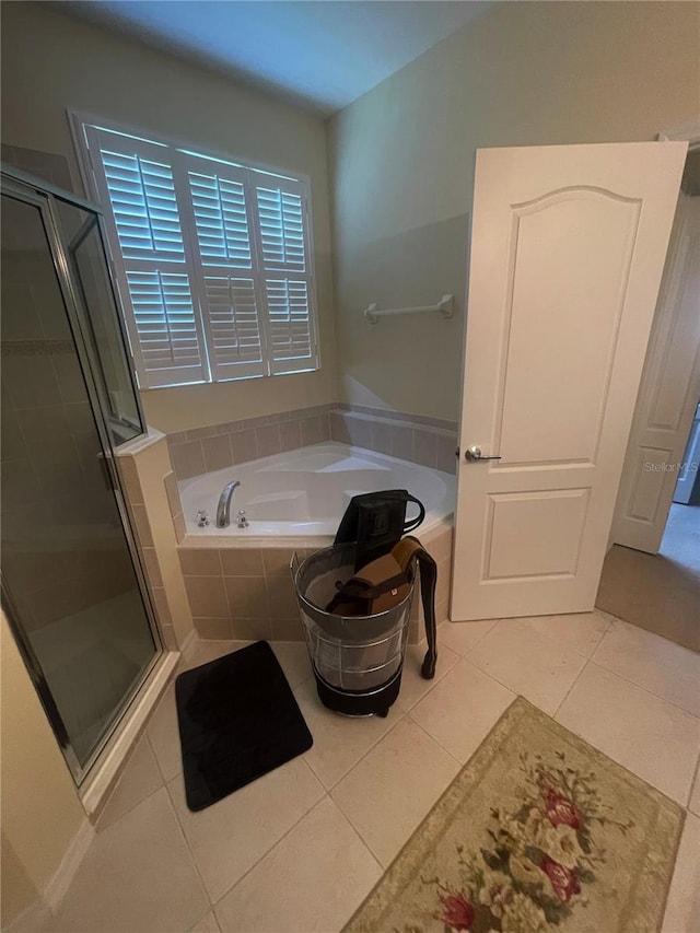 bathroom featuring tile patterned flooring and plus walk in shower