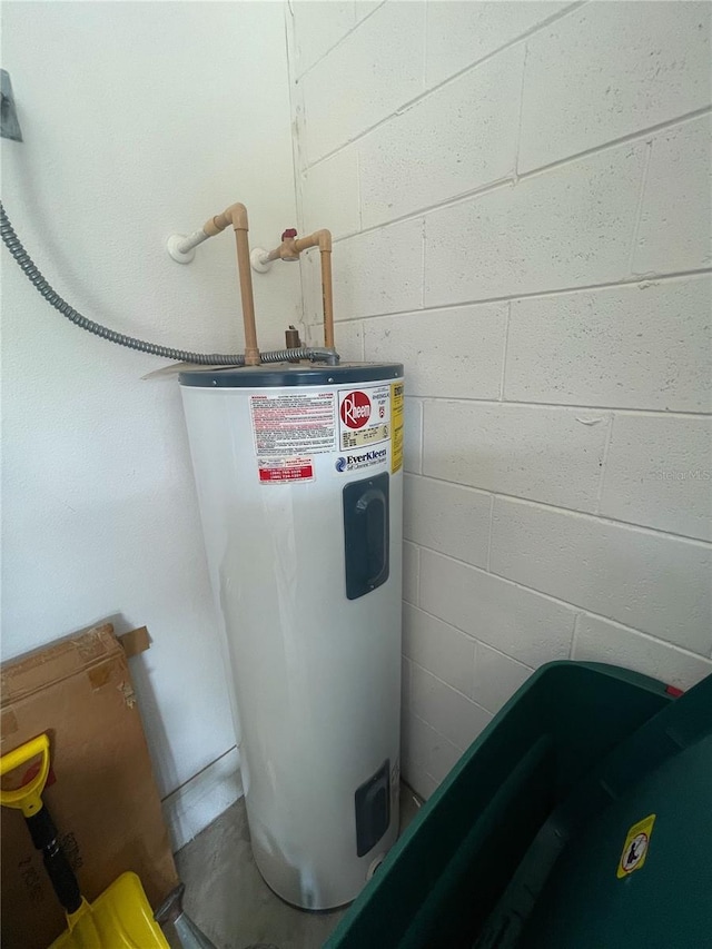 utility room featuring electric water heater