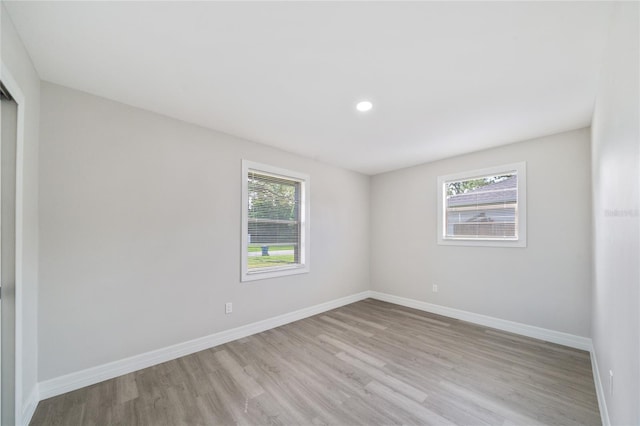 empty room with light hardwood / wood-style floors