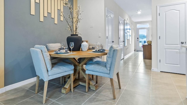 dining area with tile patterned flooring