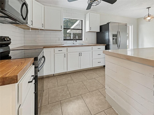 kitchen with stainless steel fridge with ice dispenser, sink, white cabinets, hanging light fixtures, and black / electric stove