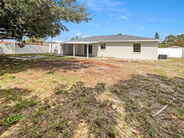 back of property with cooling unit