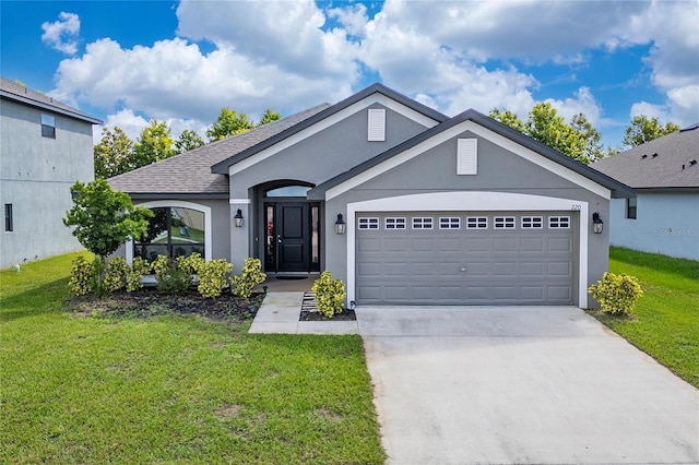 220 Bergamot Loop, Davenport, FL 33837 - ranch-style home with stucco siding, a front yard, an attached garage, and driveway
