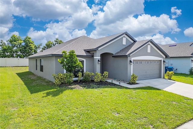 view of front of house featuring a front lawn and a garage