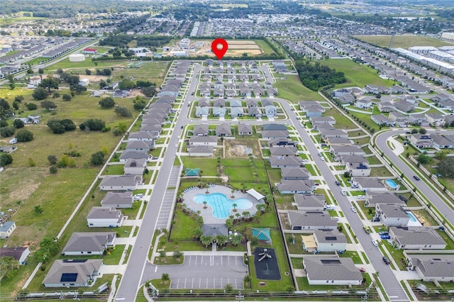 220 Bergamot Loop, Davenport, FL 33837 - aerial view of property's location with a pool and nearby suburban area