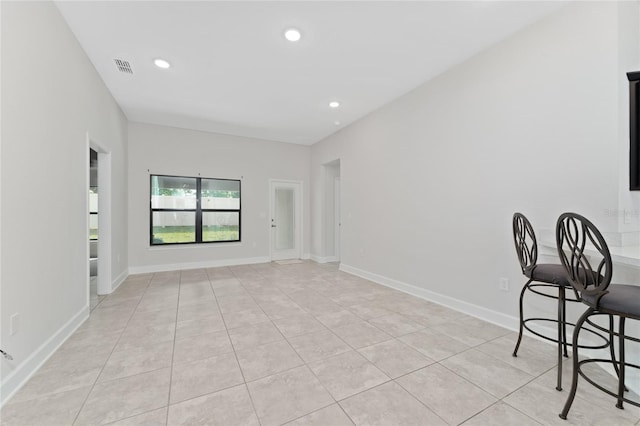 unfurnished room featuring light tile patterned flooring