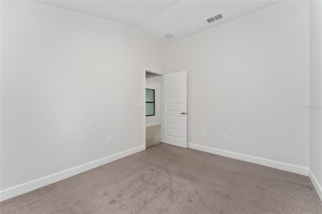 220 Bergamot Loop, Davenport, FL 33837 - carpeted spare room with vaulted ceiling and baseboards