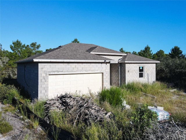 ranch-style house featuring a garage