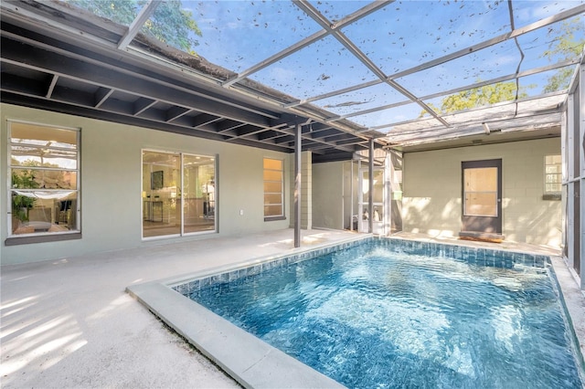 view of pool featuring a lanai and a patio area