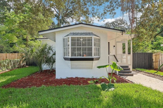 view of front of home with a front yard