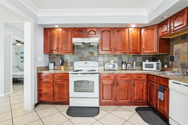 kitchen featuring sink, ornamental molding, white appliances, and decorative backsplash