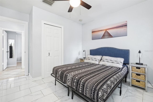 bedroom featuring a closet and ceiling fan