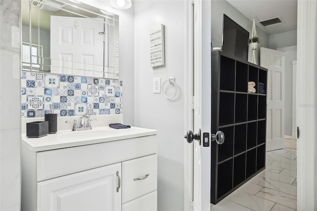 bathroom featuring backsplash and vanity